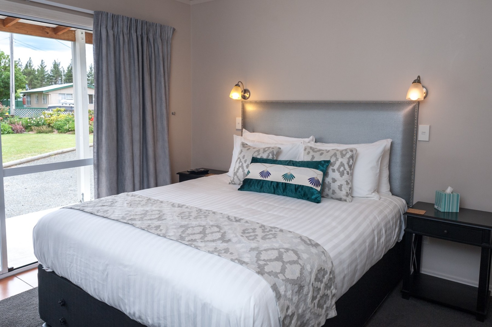 Bedroom with large bed and headboard.jpg